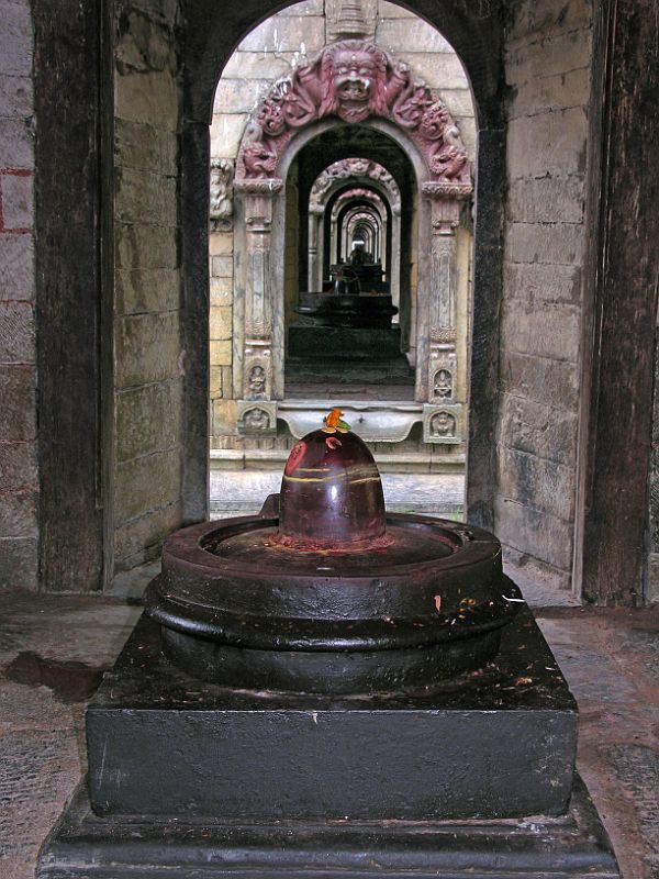 Kathmandu Pashupatinath 16 Chaityas Stupas With Lingam After crossing the Bagmati River at Pashupatinath near Kathmandu, Charlotte noticed how the 11 small stone Chaityas (stupas), each with a lingam, lined up nicely to give a seemingly endless mirror effect.